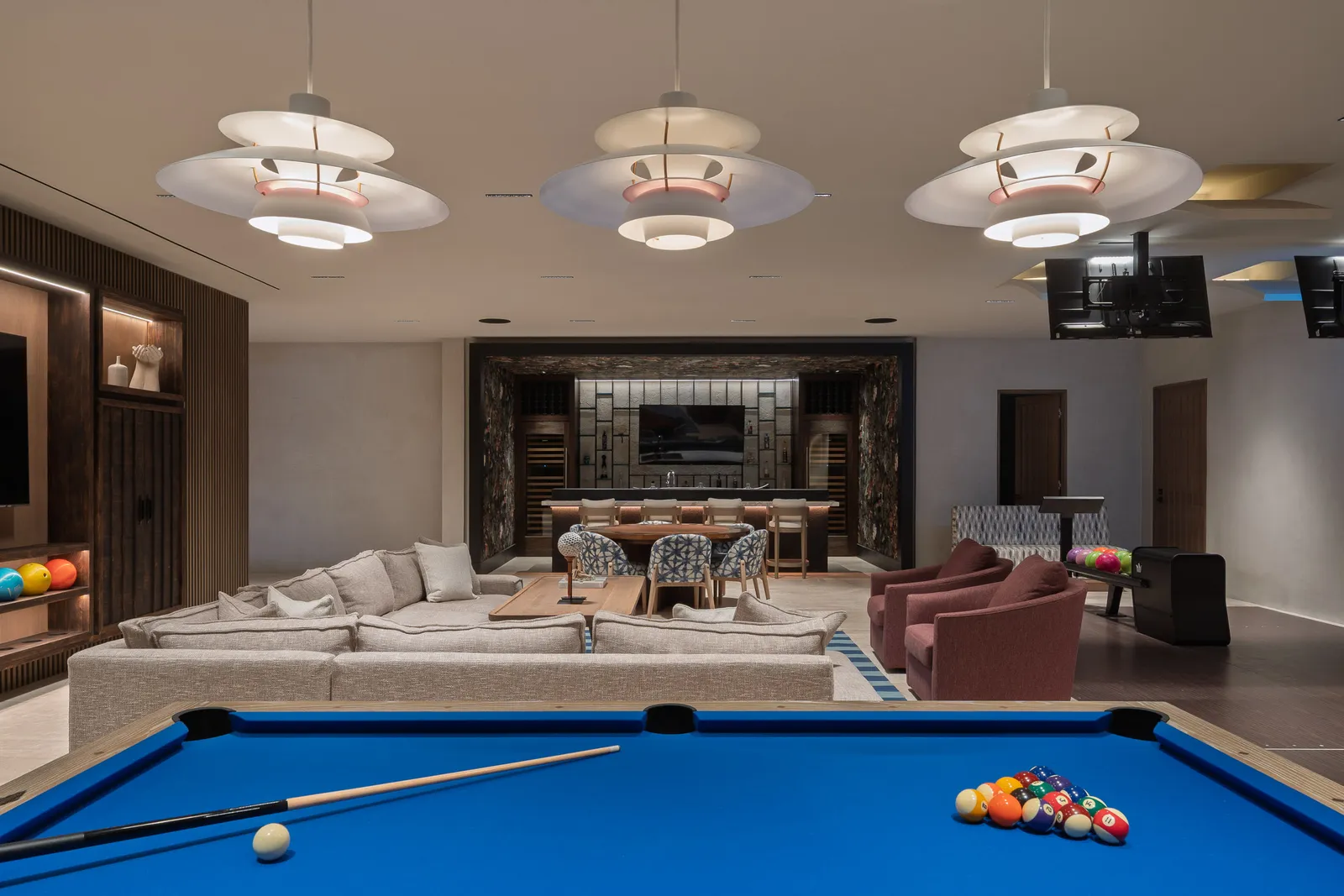 The pool table racked and ready, the lounge and bar beyond