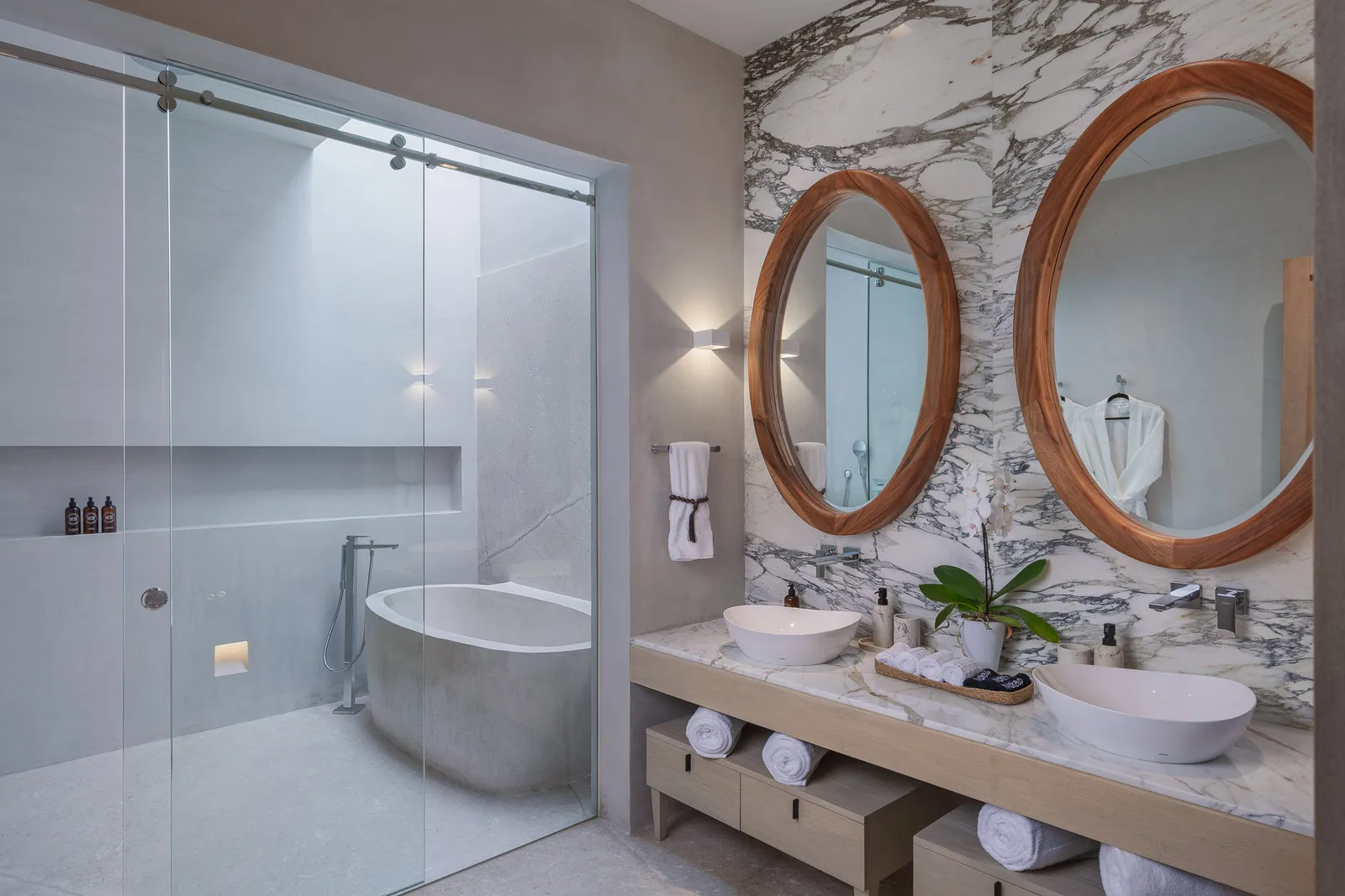 The Mountain Suite bath — the carved stone tub beneath its skylight