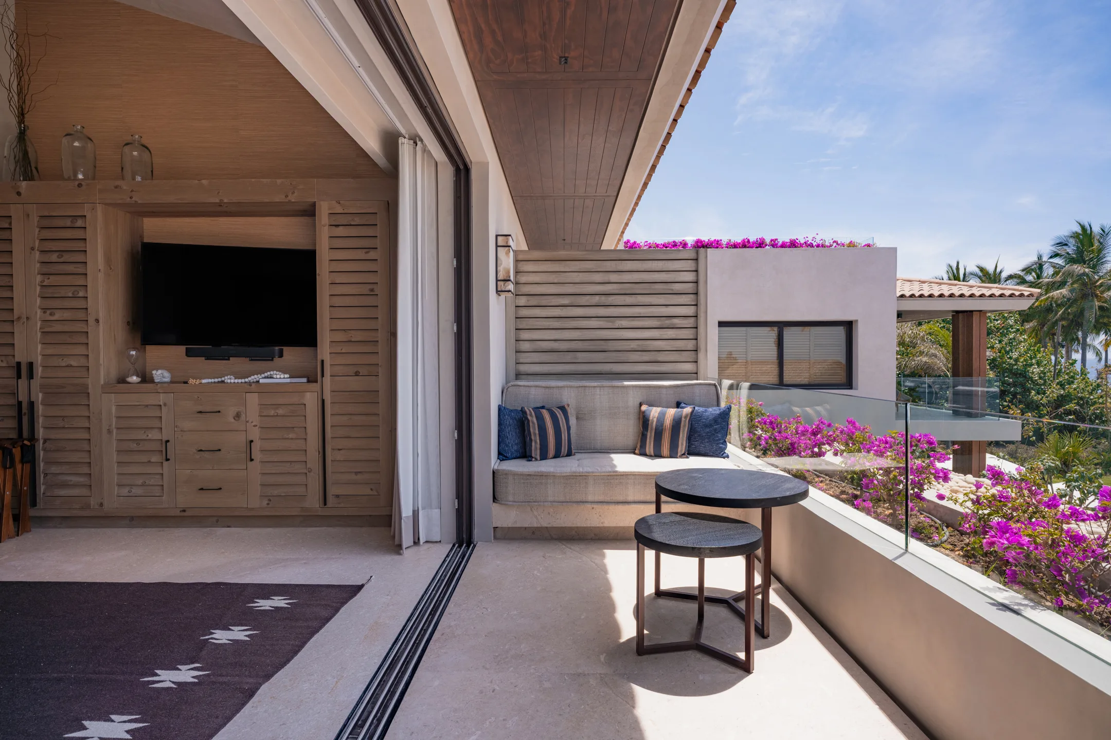 The Mountain Suite’s private terrace — built-in daybed among the bougainvillea