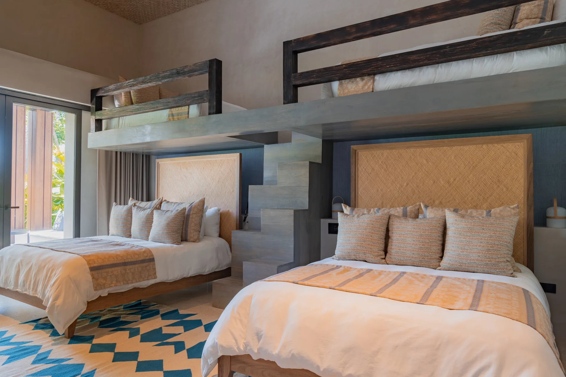 The Water Suite’s four sleeping tiers — two queens below, two bunk lofts above