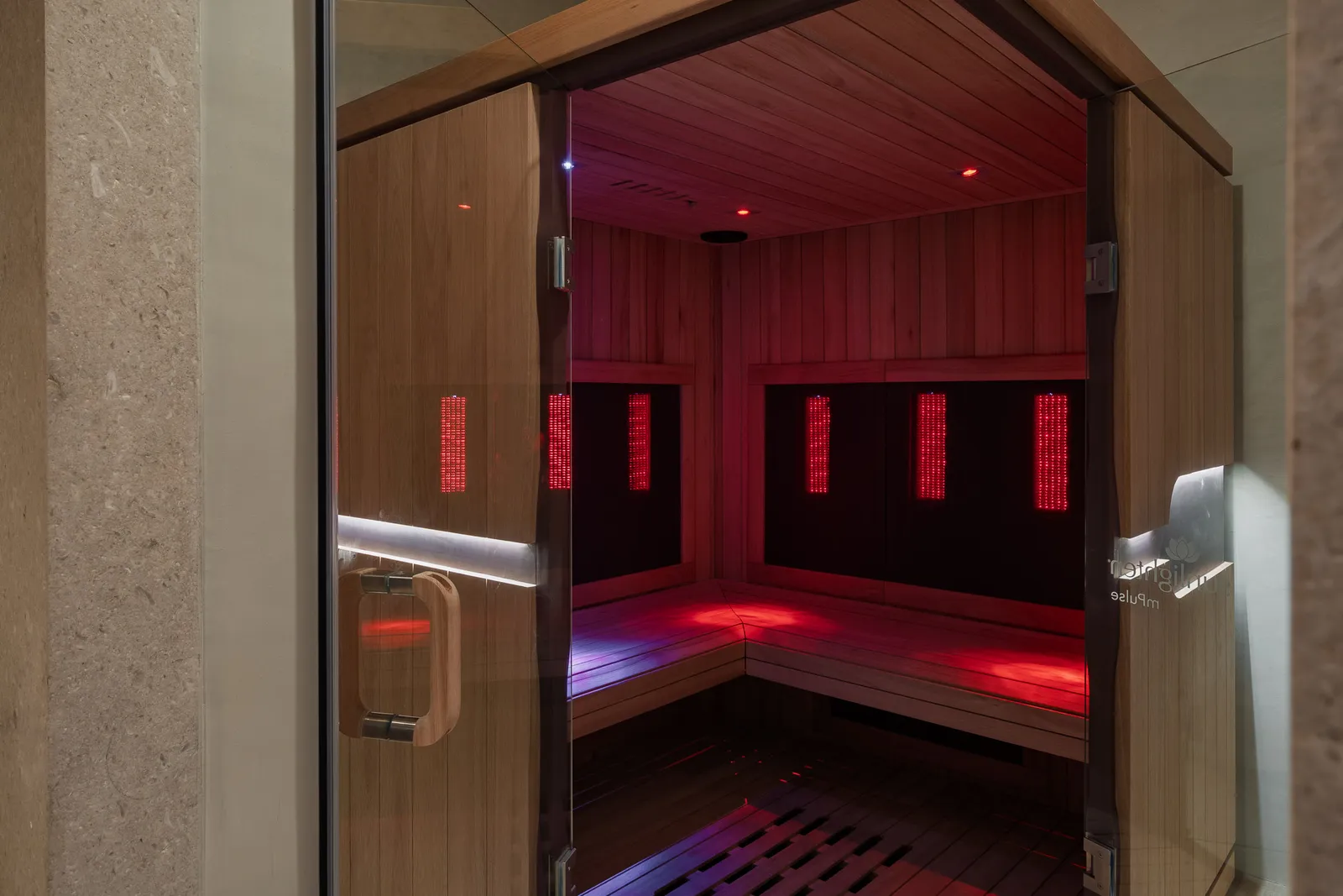 The full-spectrum infrared sauna glowing warm red