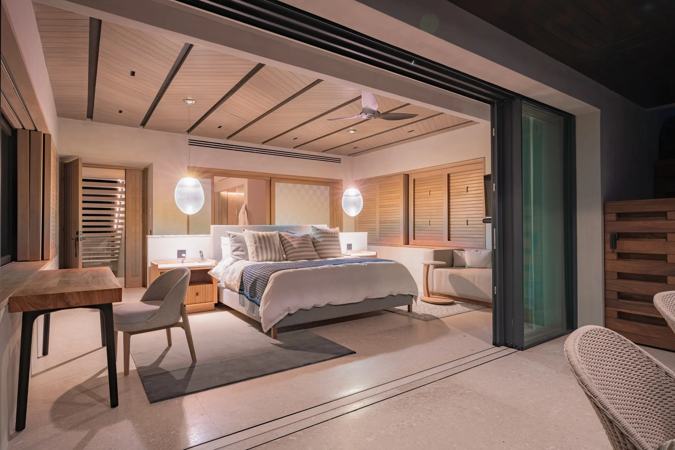The Star Suite at dusk, the room lit warm against the evening