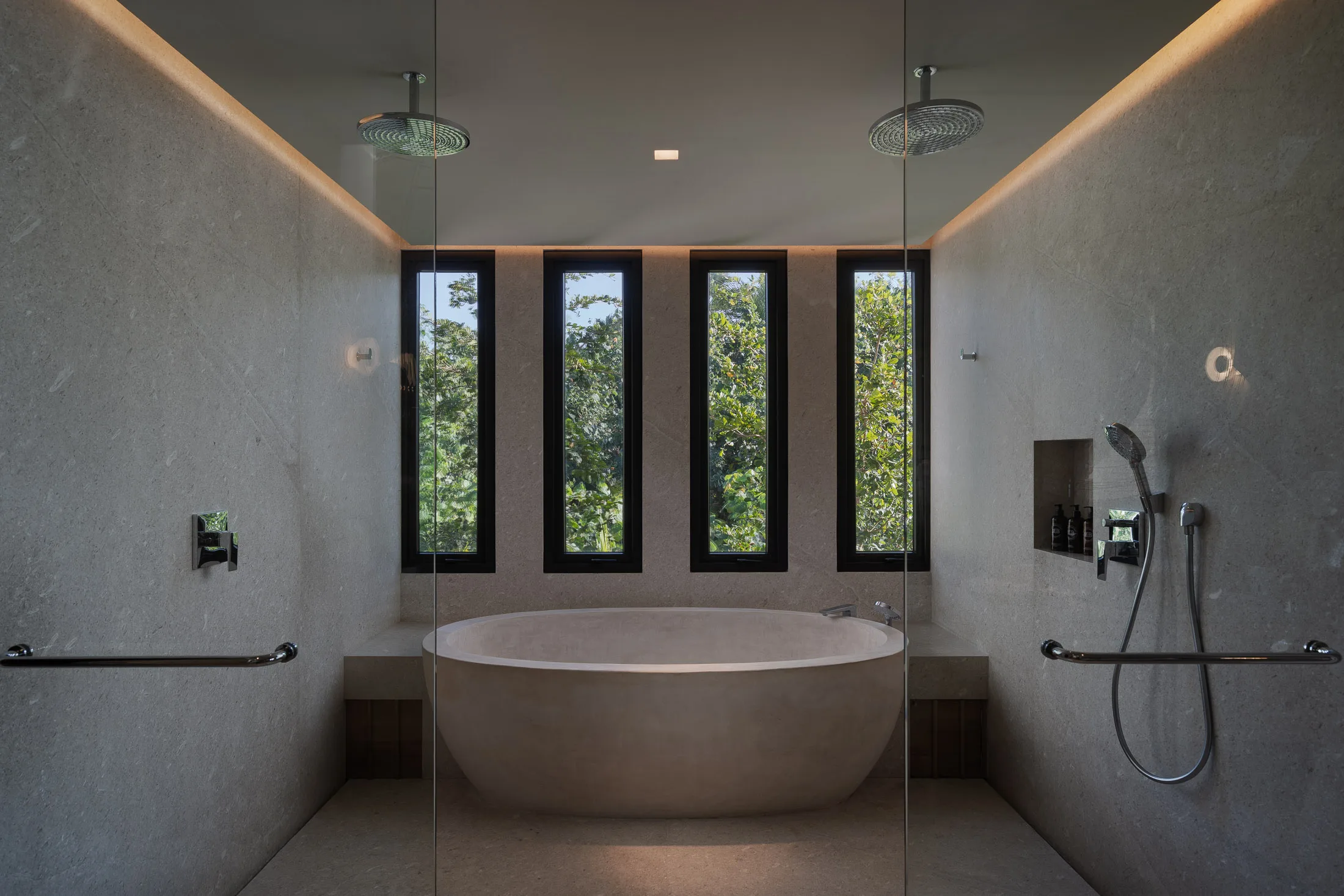 The Star Suite’s double rain showers over the tub room, windows to the green