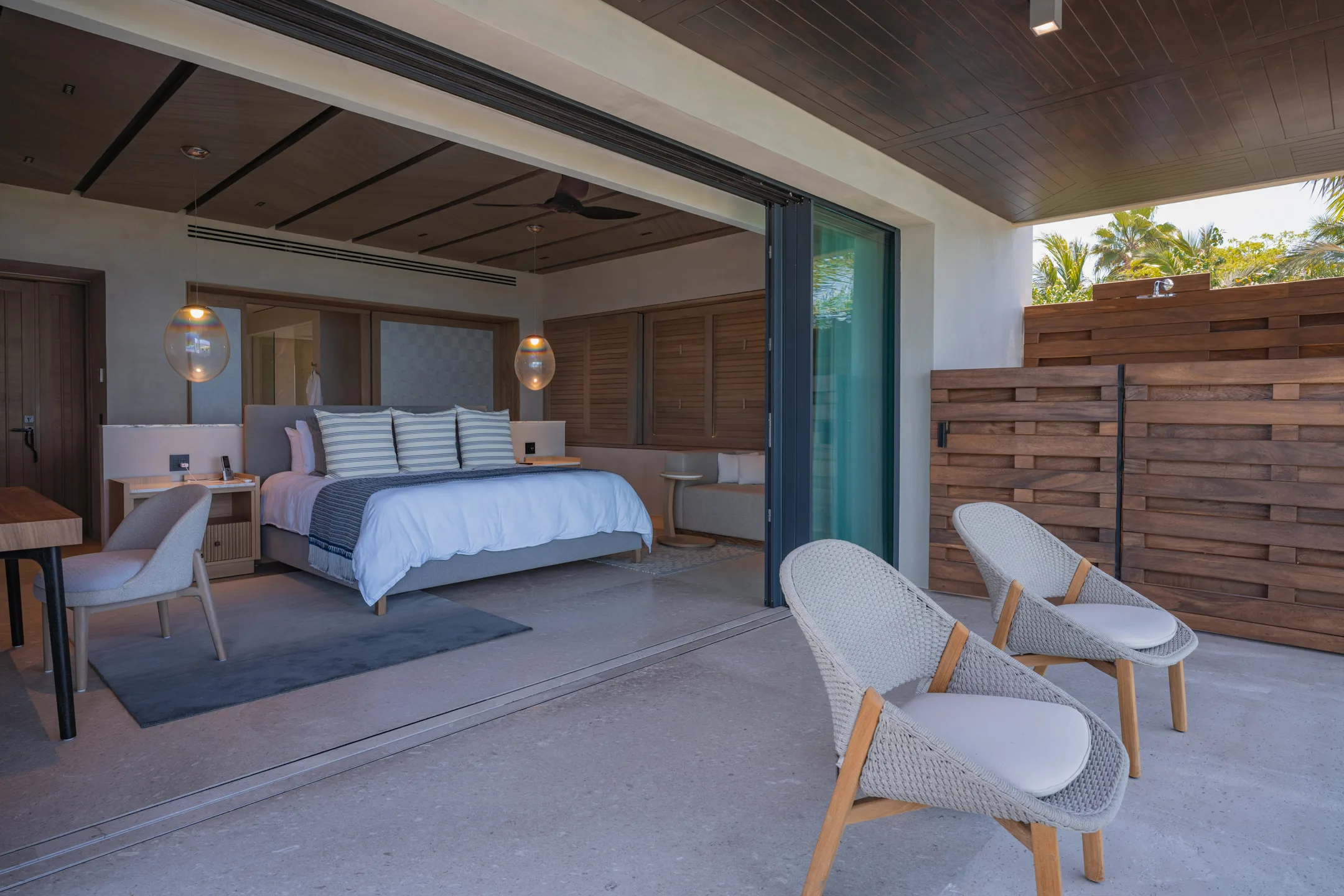 The Star Suite from behind the bed, looking out to the terrace and its privacy screen